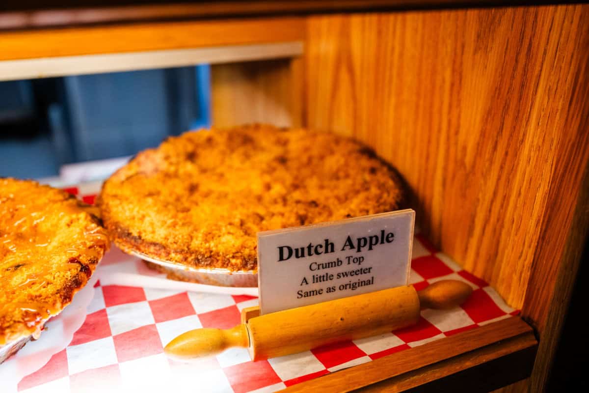 a bakery cabinet with a Dutch crunch pie