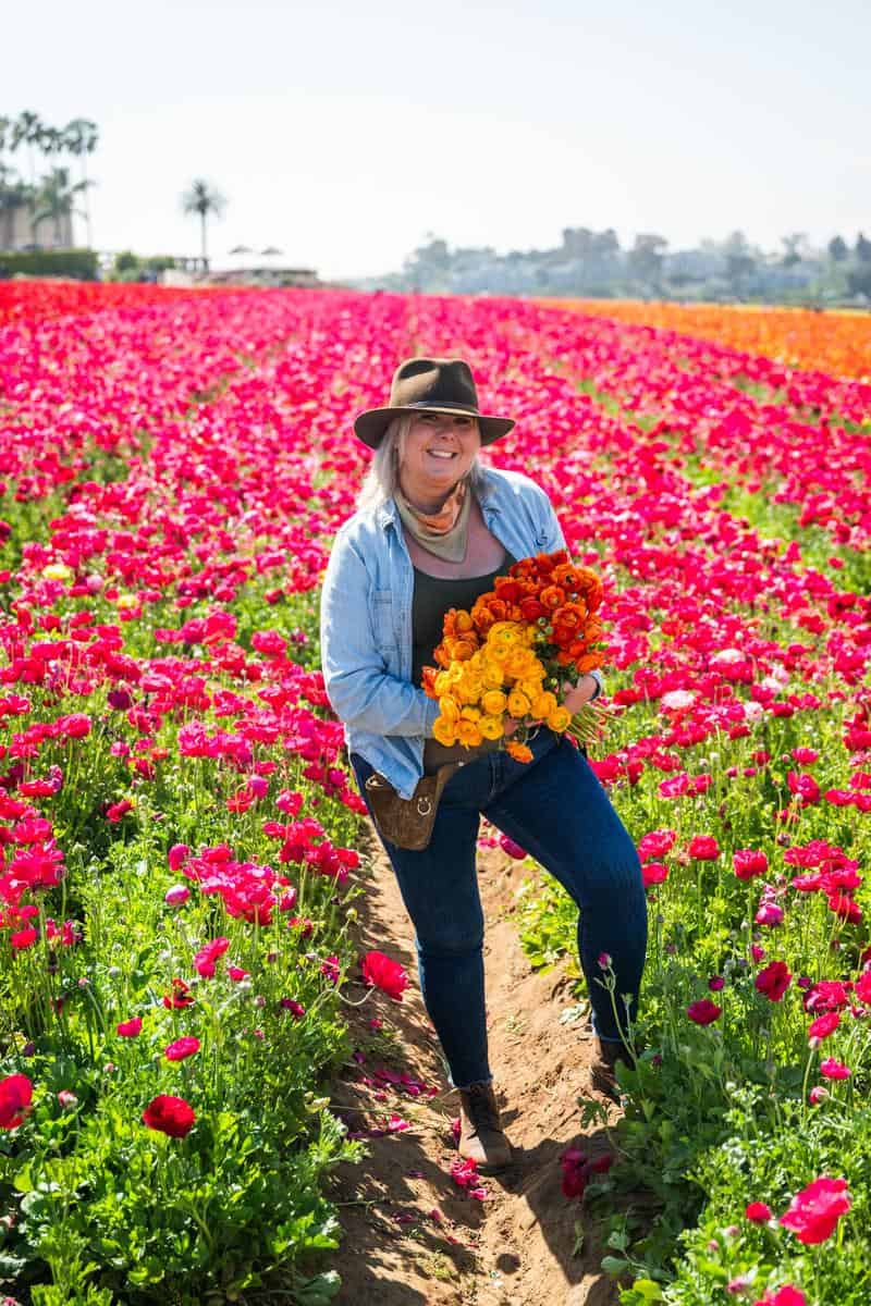 Elizabeth Ecke in a field of flowers