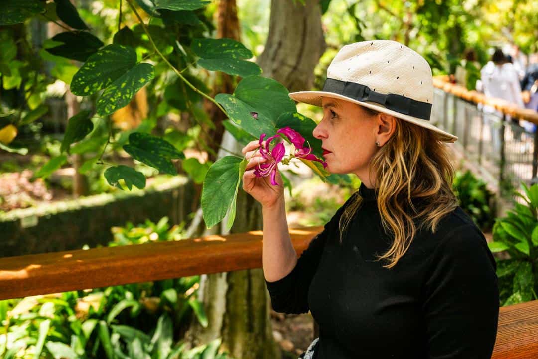 Kate taking in the sweet scents of The Monarch Garden at Gilroy Gardens