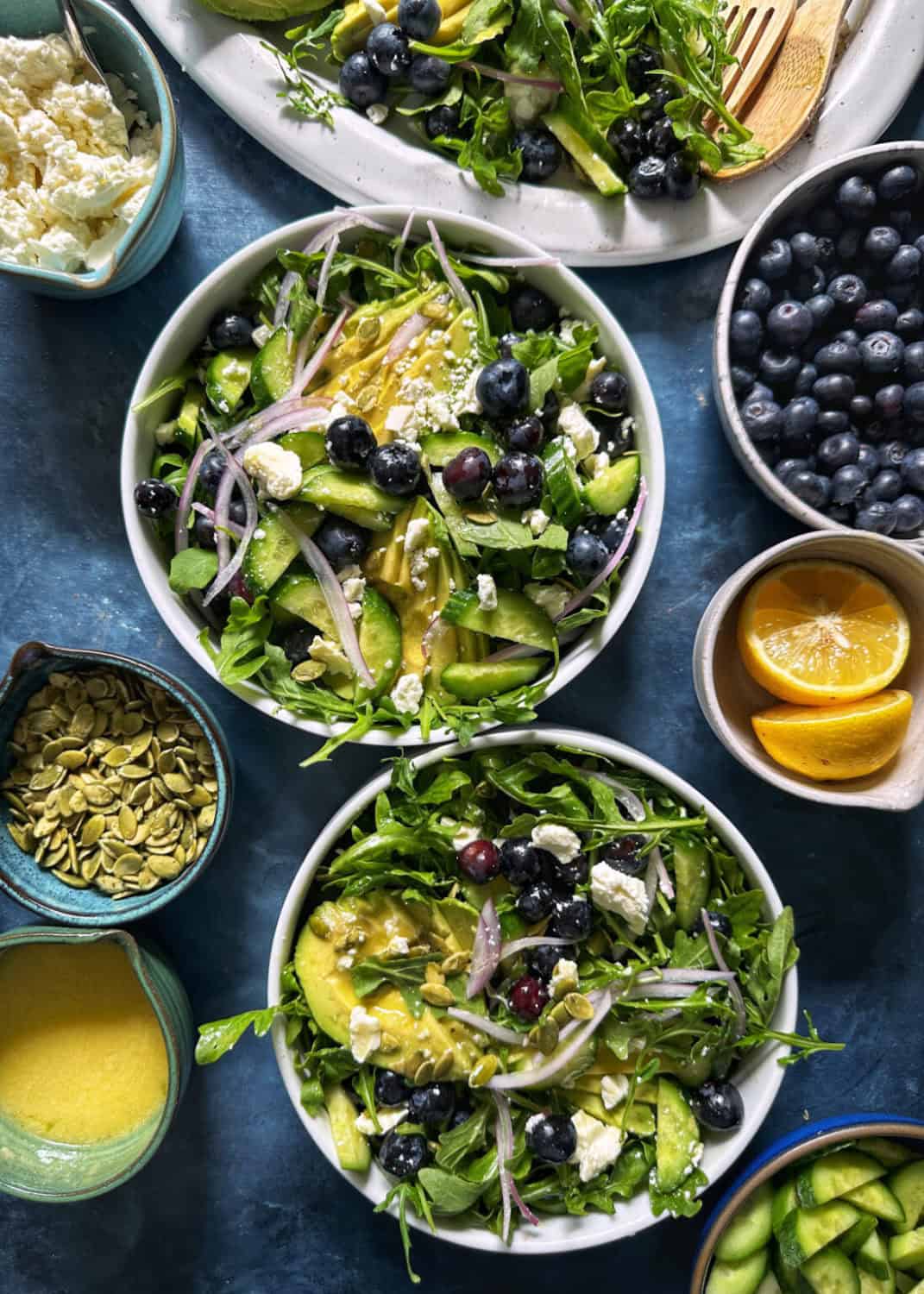 two bowls of Blueberry Avocado Salad with Lemon Dressing from The Delicious Life