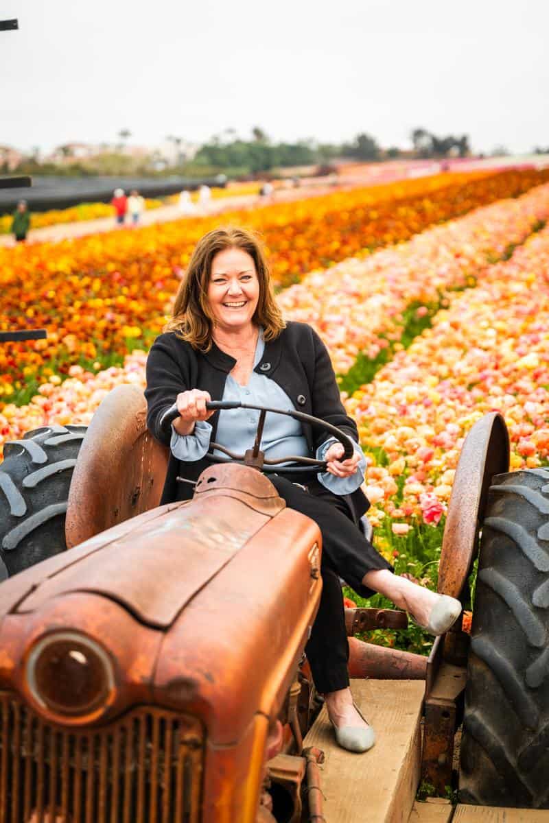 woman riding tractor at the flower fields in carlsbad, CA