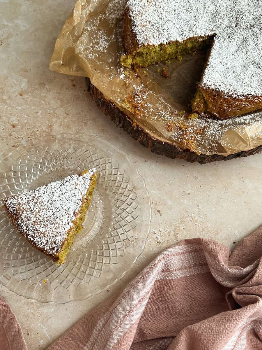 pistachio cake slice on on plate