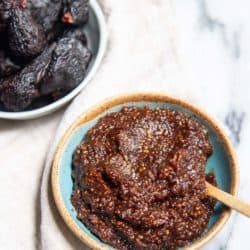 A bowl of dried figs and a bowl of mostarda.