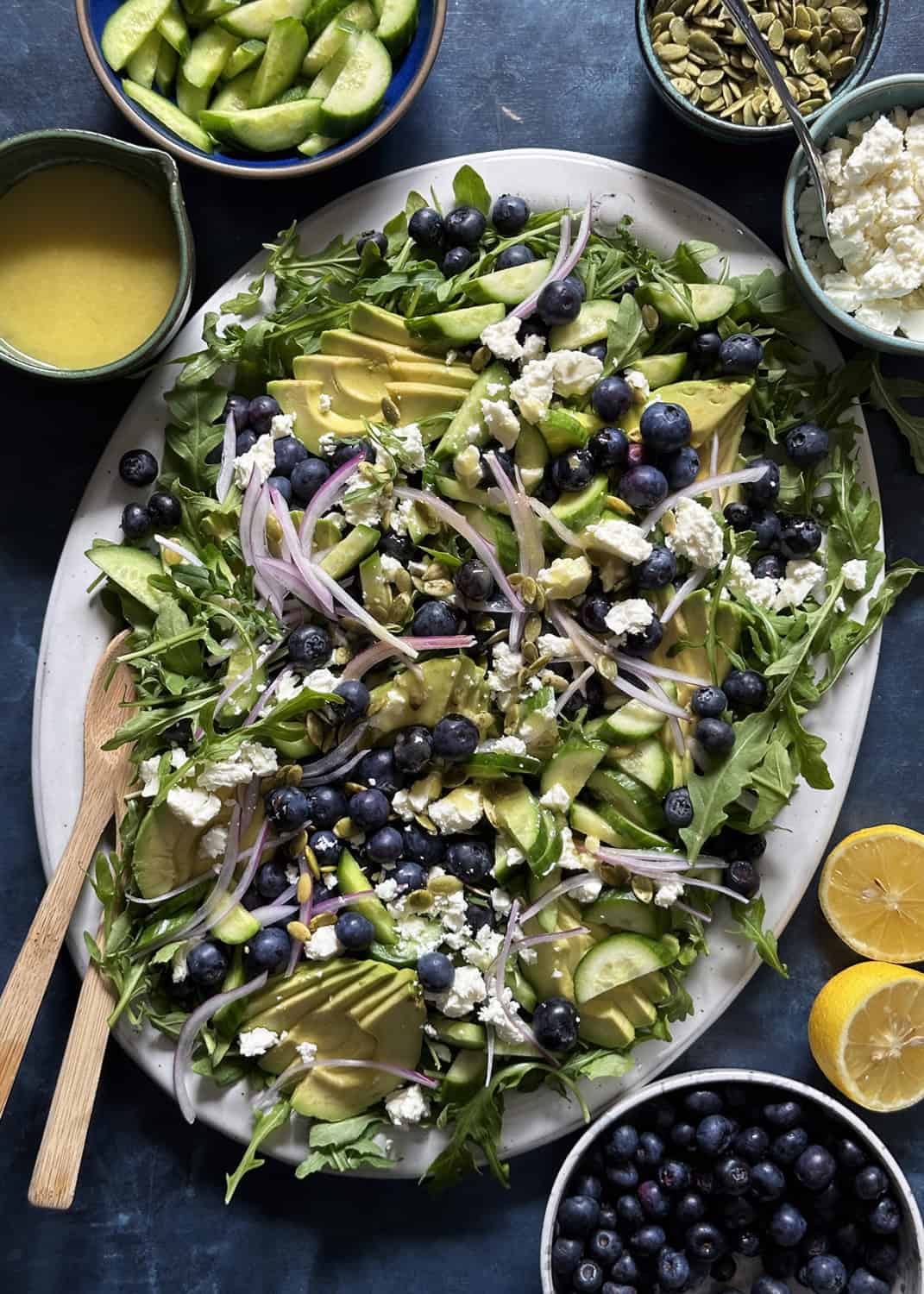 big blueberry salad on a white platter