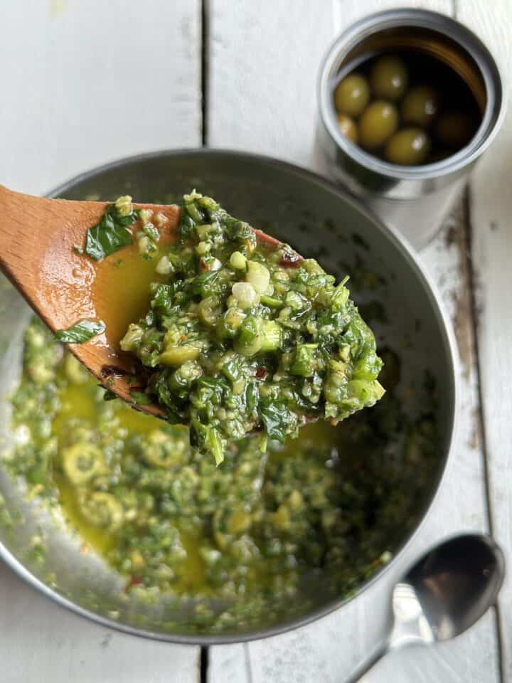 chimichurri on a wooden spoon