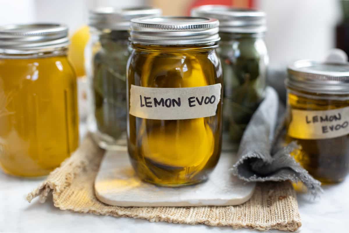 jars full of infused lemon olive oil