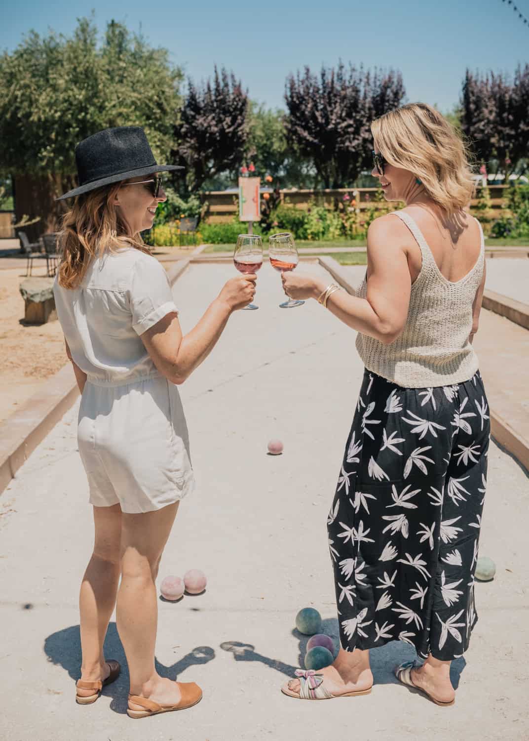 two women enjoying a game of bocce ball at Michael David Winery