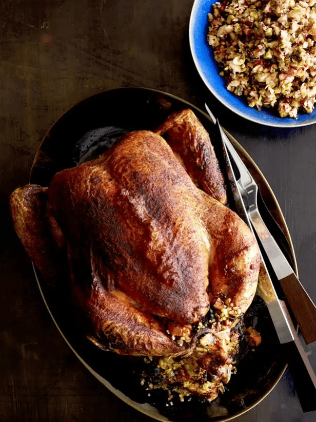 roasted capon on a dark platter