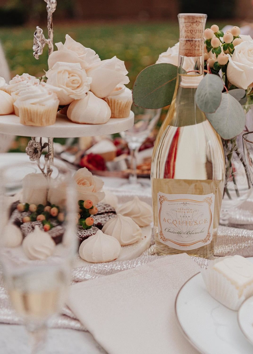 Romantic dessert table with white wine from Acquiesce (label exposed)