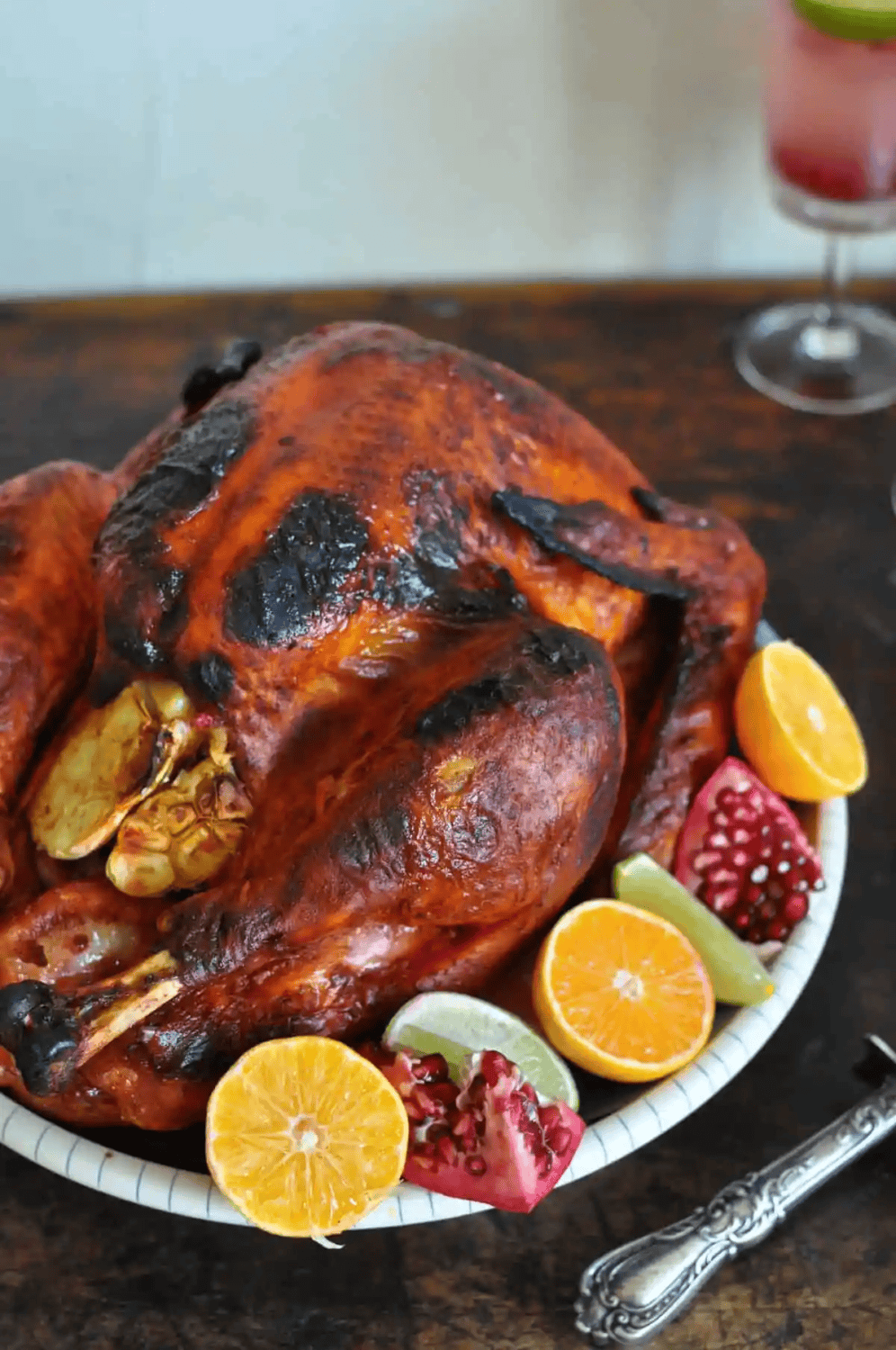 mexican style roasted turkey garnished with pomegranates and slice oranges