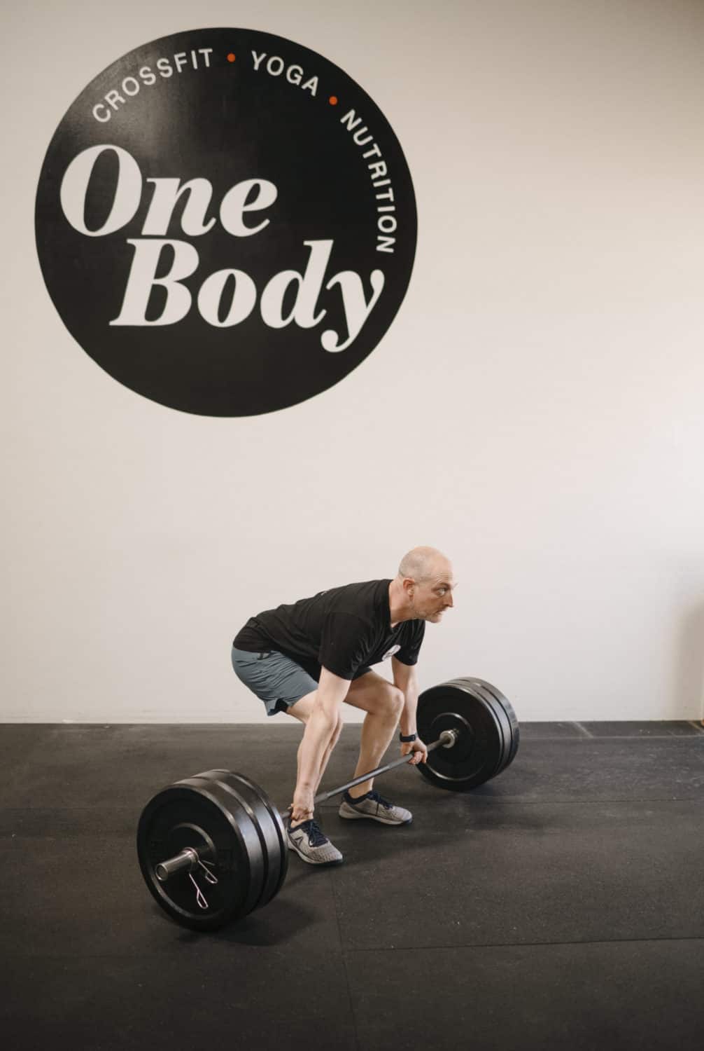 drew machado lifting weights at One Body Fitness