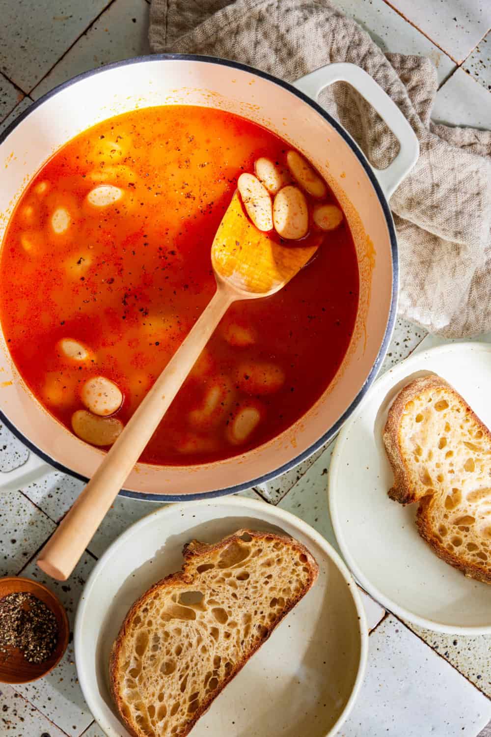 brothy beans in tomato miso broth
