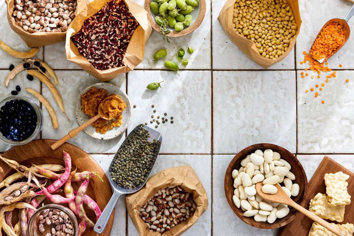 a variety of dried beans displayed in various containers