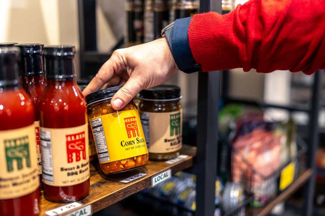 Jars of local sauces on display at the Sunsweet Grower Store