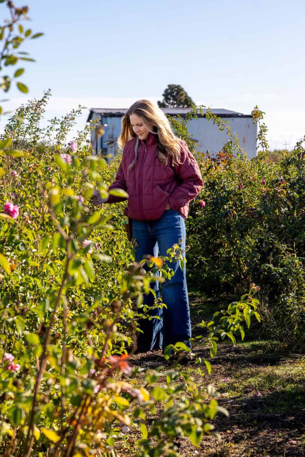 Felicia Alvarez walking through Menagerie Farm and Flower