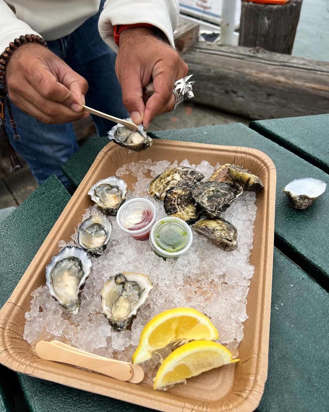 oysters served on ice with lemons