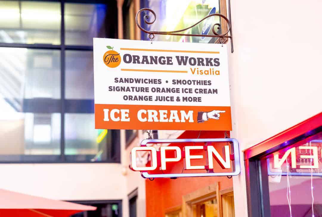 a sign for orange works cafe