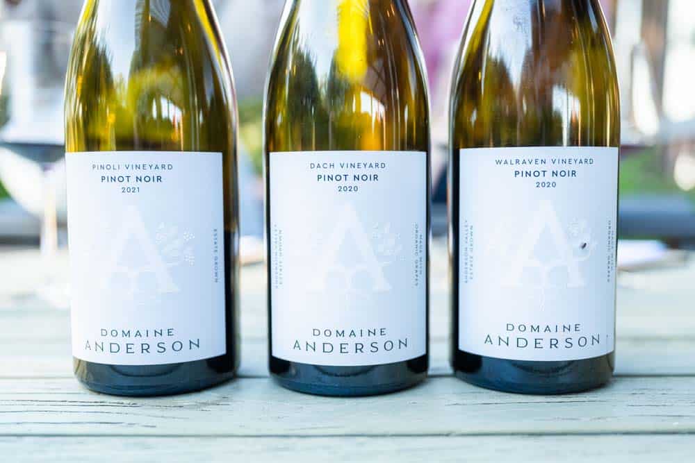 Three bottles of Domaine Anderson wine. 