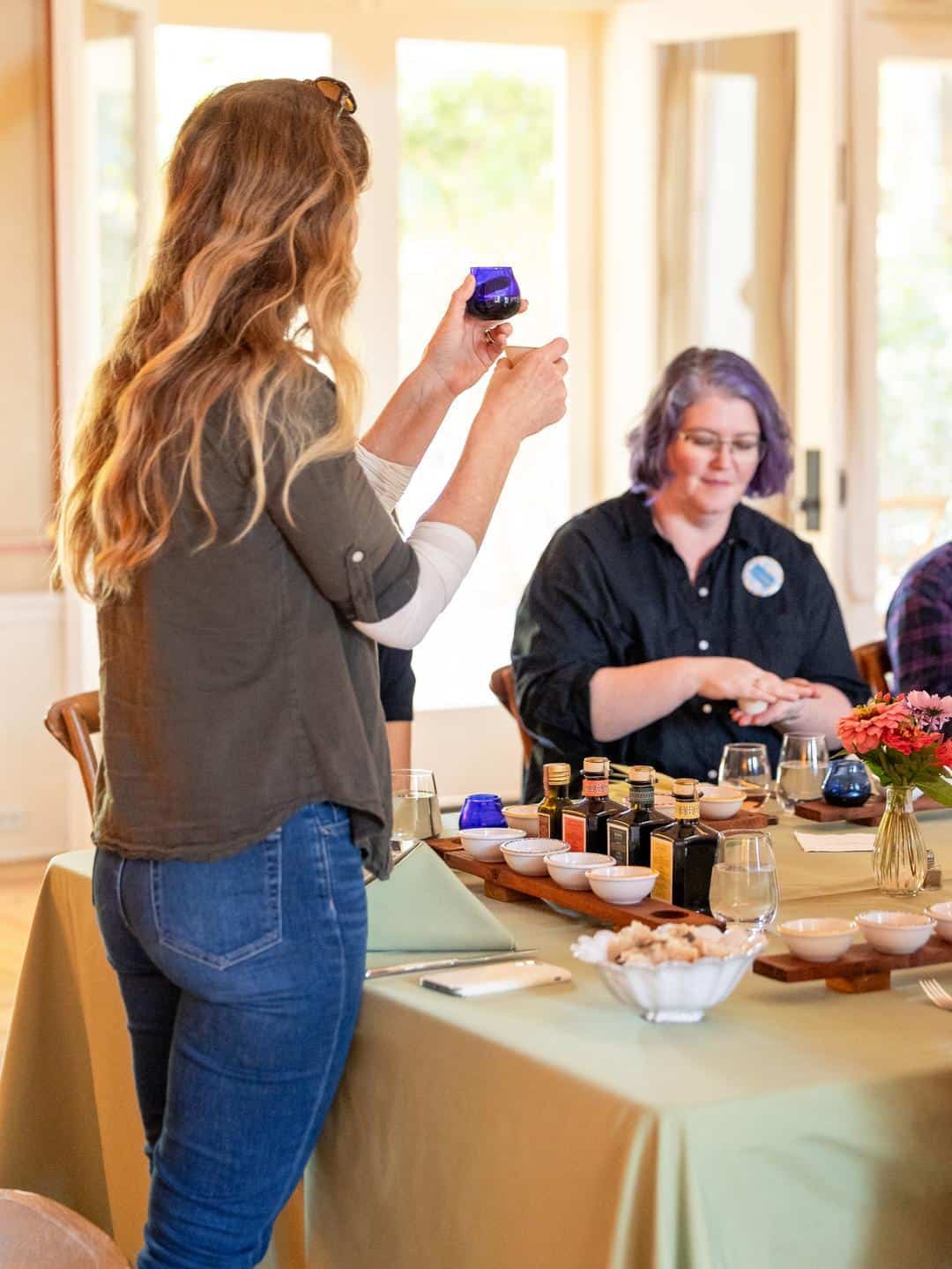 Olive oil tasting using a blue tulip cup at McEvoy Ranch