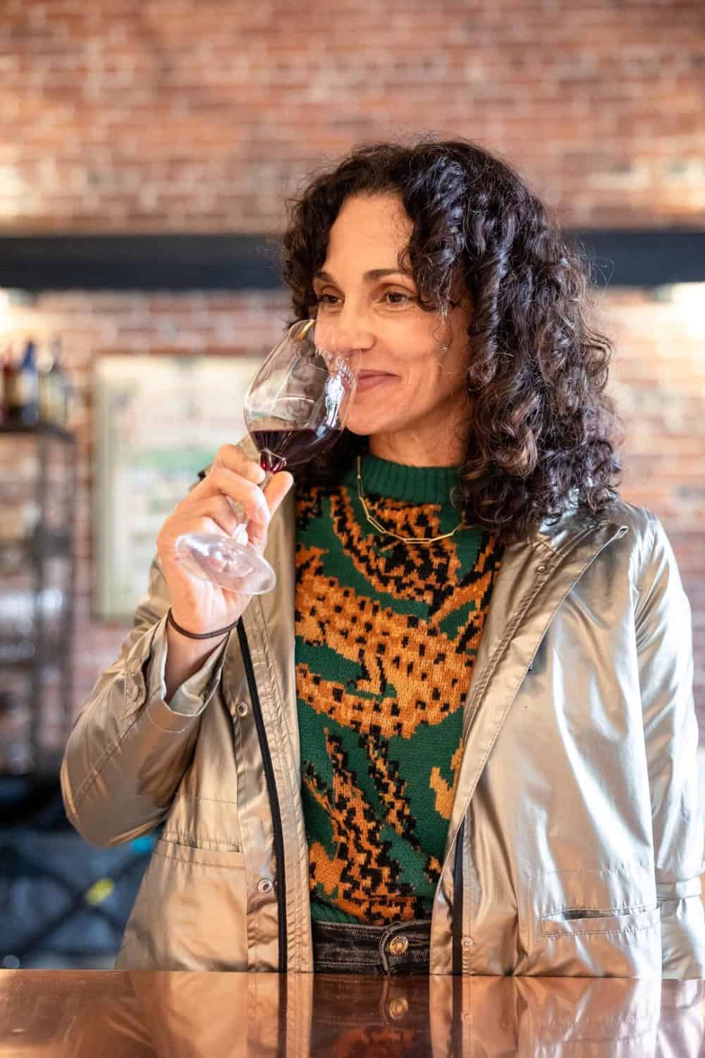 woman tasting red wine at New Clairvaux 