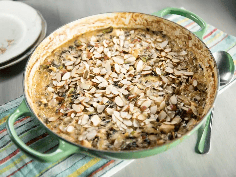 chicken rice casserole in a baking dish garnished with almonds