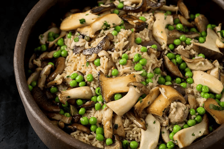 baked chicken and rice with mushrooms with peas