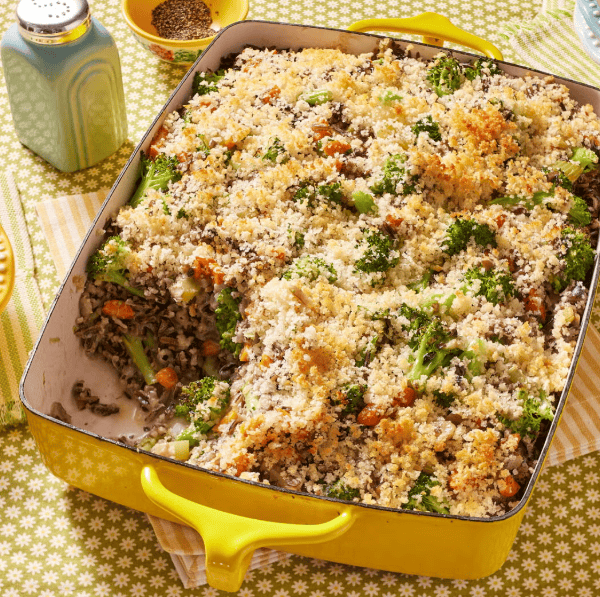 pioneer woman's wild rice and broccoli casserole in a yellow dish