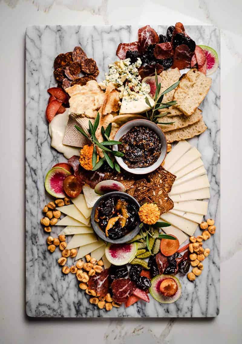 The Ultimate Cheeseboard with cheese, nuts, fresh and dried fruit