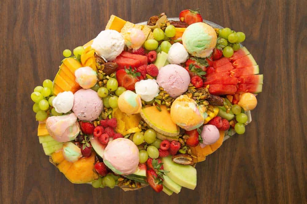 Melon and ice cream platter on a table.