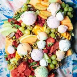 A Unique Mixed Melon and Cantaloupe Dessert Platter with scoops of ice cream and sherbet.