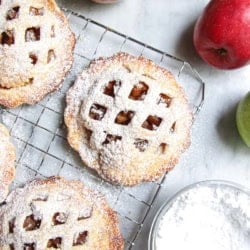 Apple hand pies dusted in powdered sugar.