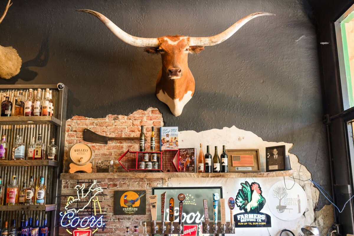 Steer heads and bottles gleaming on the wall at Five Marys Burgerhouse in Fort Jones