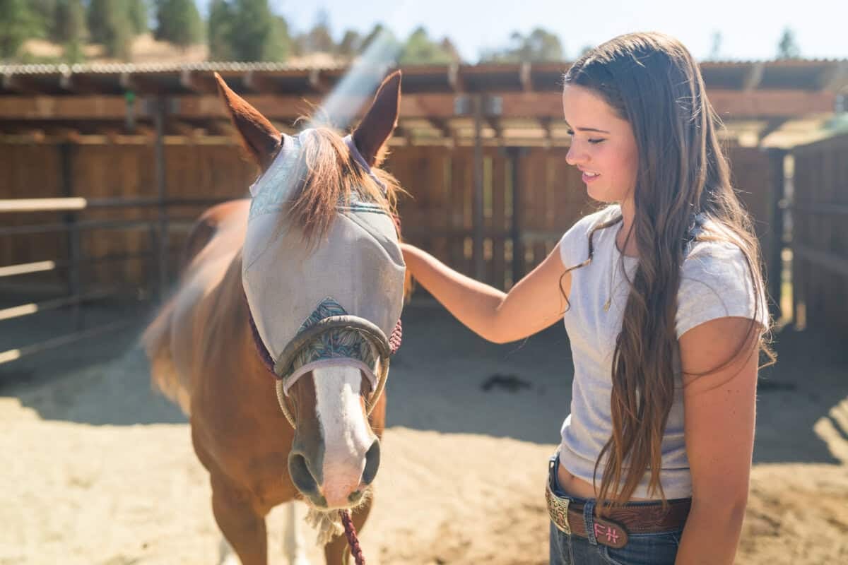 Francie Heffernan with a horse at Five Marys Ranch