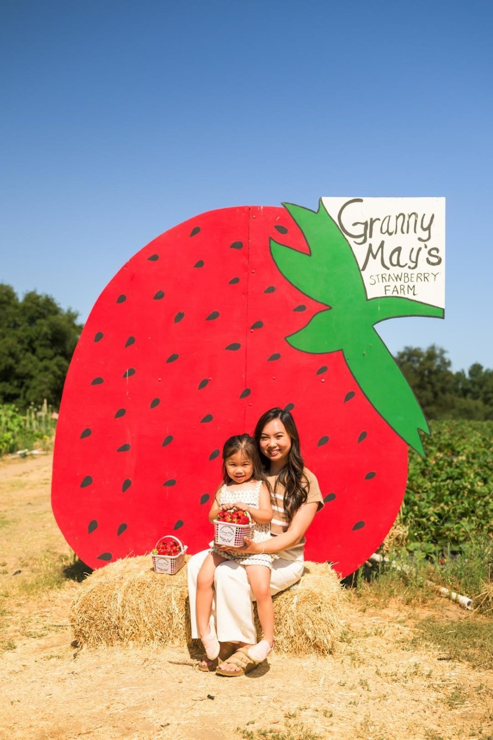 Elisabeth and her niece enjoying a photo op at Granny May's Strawberry Farm 