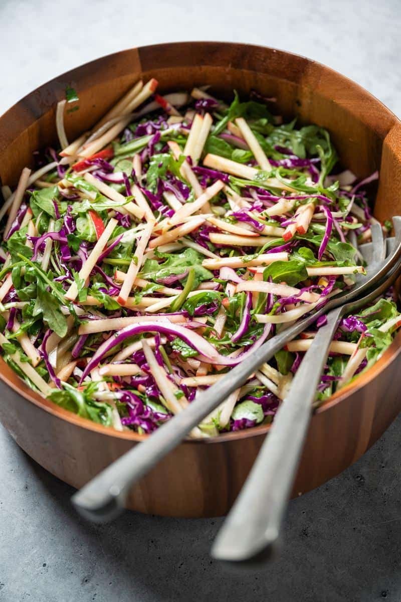 fennel apple salad in a wooden bowl