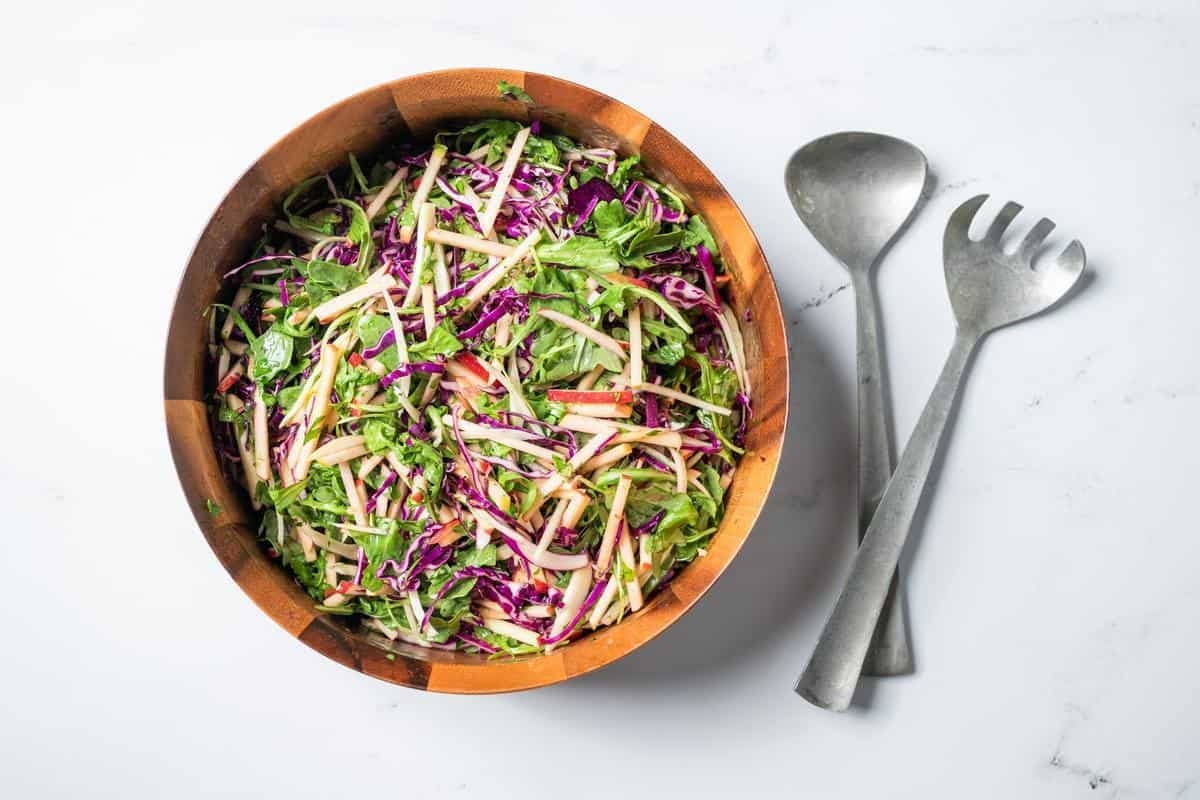 fennel apple salad in a wooden bowl