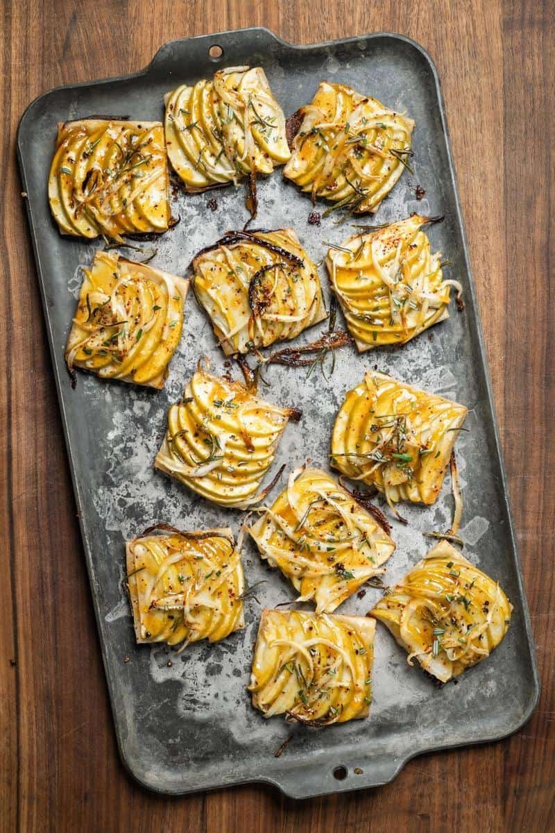 savory apple tarts on a baking sheet - overhead shot