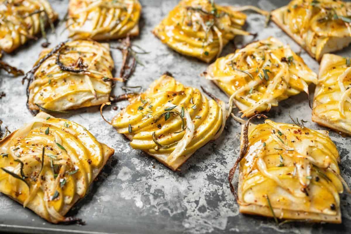 savory apple tarts on a baking sheet