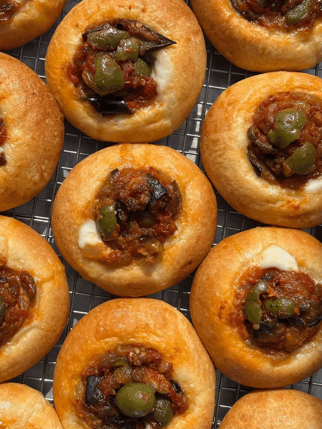 caponata nestled into a golden brown kolache bun