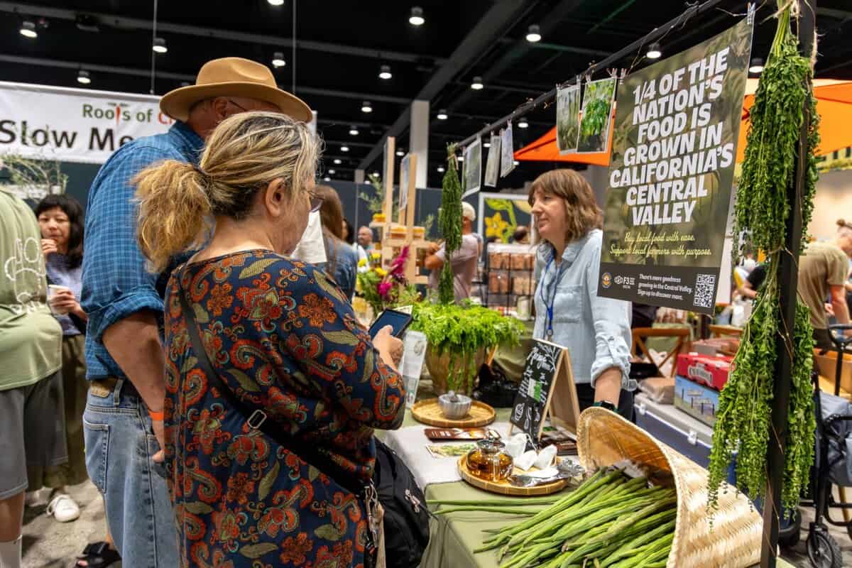 Guests at a booth at Terra Madre Americas