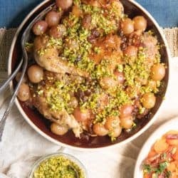 Our Best Chicken Recipe with Wine, Grapes, and Raisins topped with Pistachio Gremolata.
