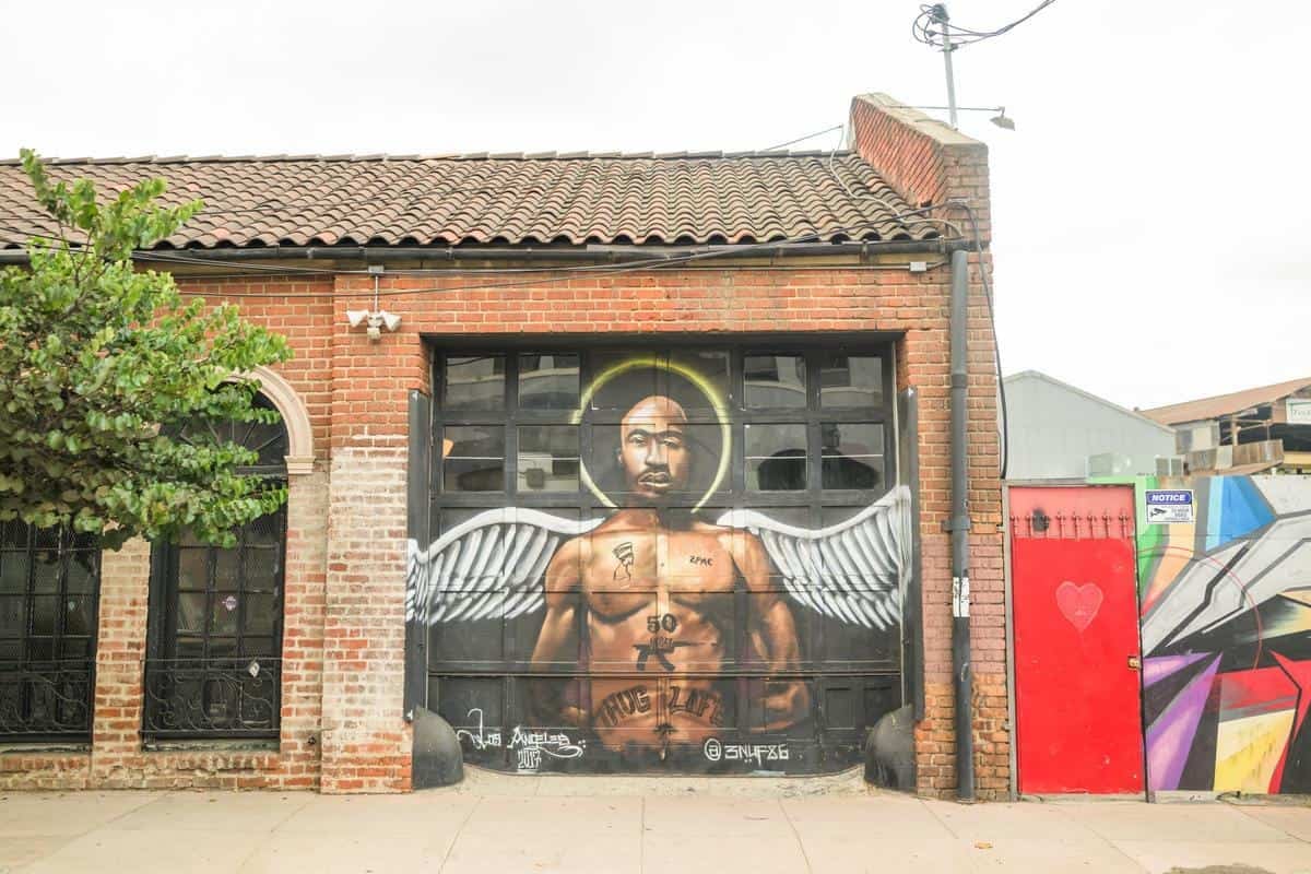 portrait of a man on the garage door of angelino wine company
