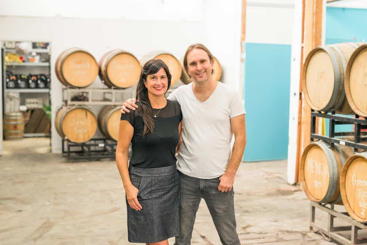 Amy Luftig and Jasper Dickson pose together inside of Angelino Wine Company
