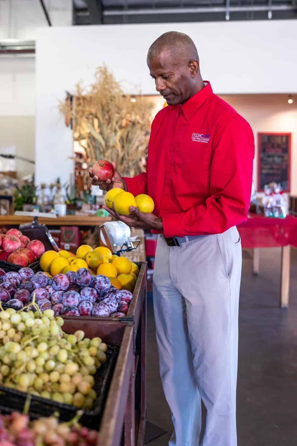 Dean St. Hilaire inspecting some of the produce at Gibson Farm Market