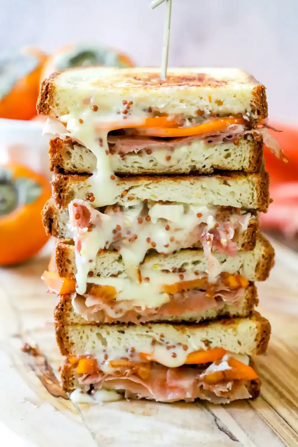 Persimmon, brie and prosciutto grilled cheese from A Girl Defloured