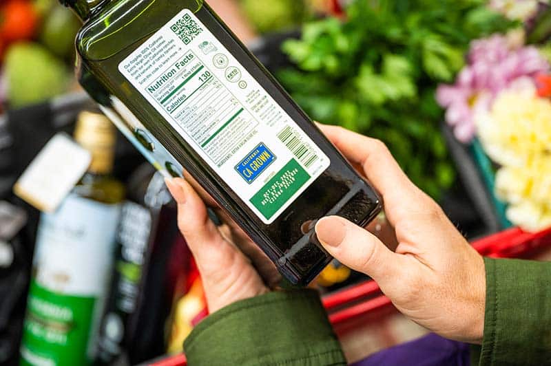 The CA GROWN license plate on the back of a bottle of olive oil.