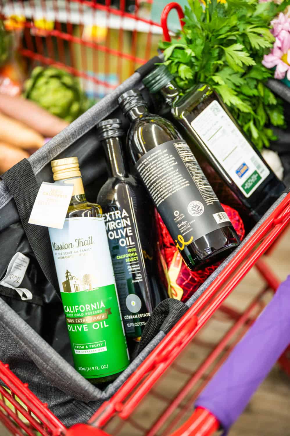 grocery cart full of CA GROWN olive oil