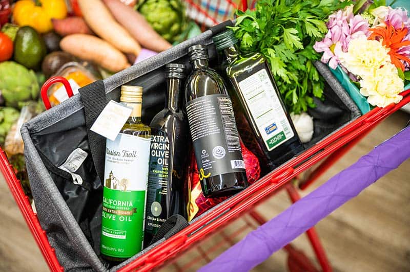 Olive oil bottles in a shopping cart