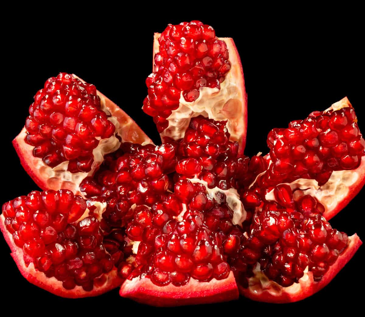 pomegranate sliced with arils exposed