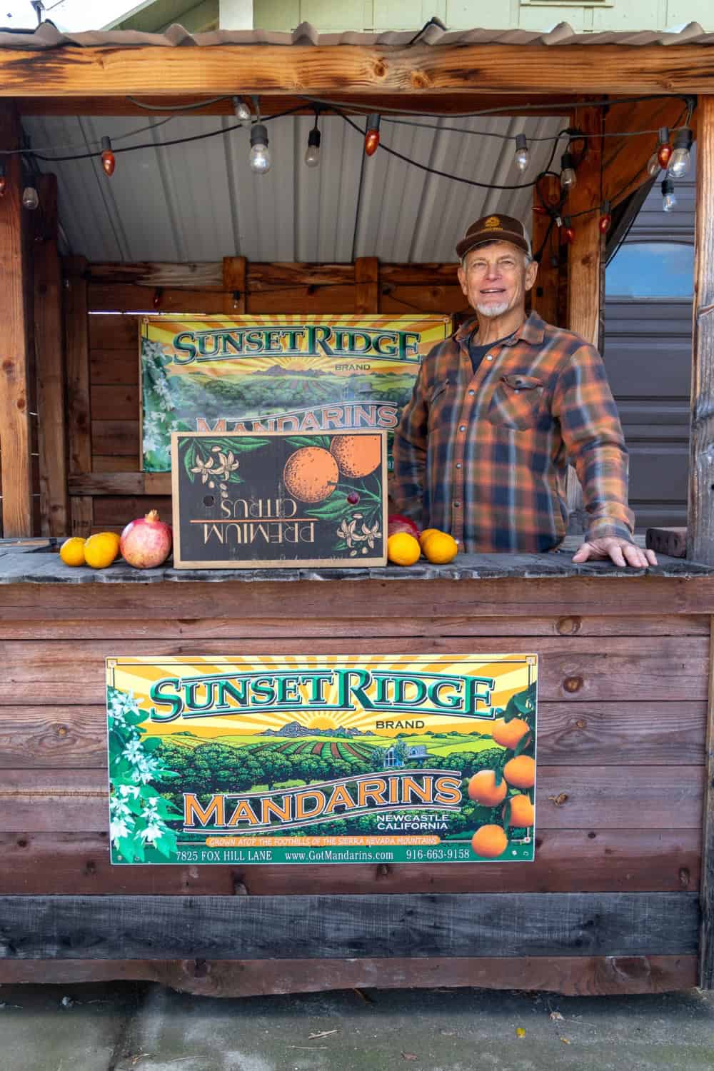 greg lewis inside the farm stand at Sunset ridge fine fruits